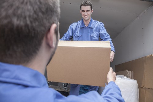 Moving boxes and household items with a van in Fulham