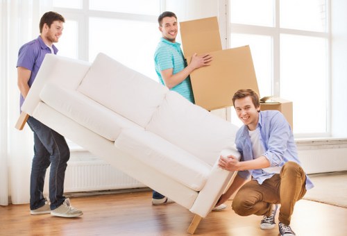 Furniture and boxes being loaded into a van in Fulham