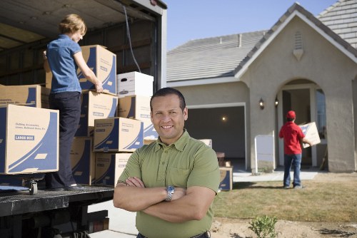 Professional Fulham moving team handling boxes and furniture