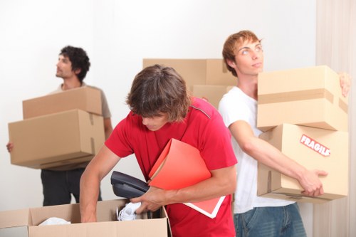 Movers handling a home removal in a Fulham street