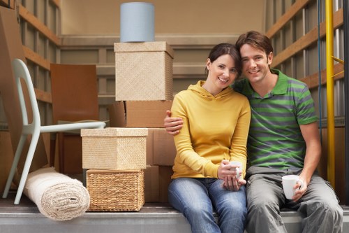 Professional movers loading items from a Fulham residence