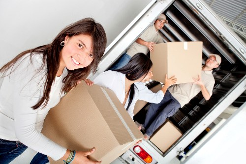 Packers handling office items for a Fulham company relocation